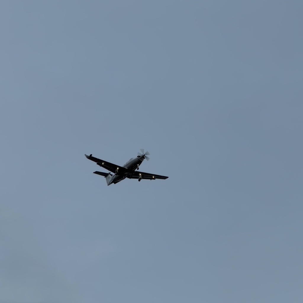 Pilatus PC-12 N185PB with landing lights on, evening approach near Broomfield Colorado